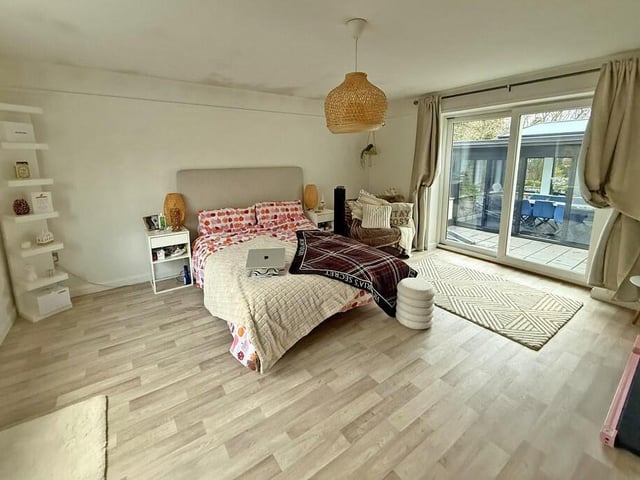 A ground floor bedroom of considerable size.