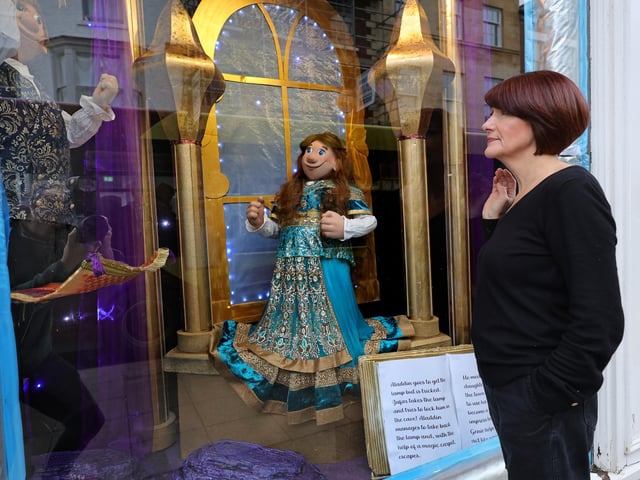 Window designer Julia Wray inspects the windows