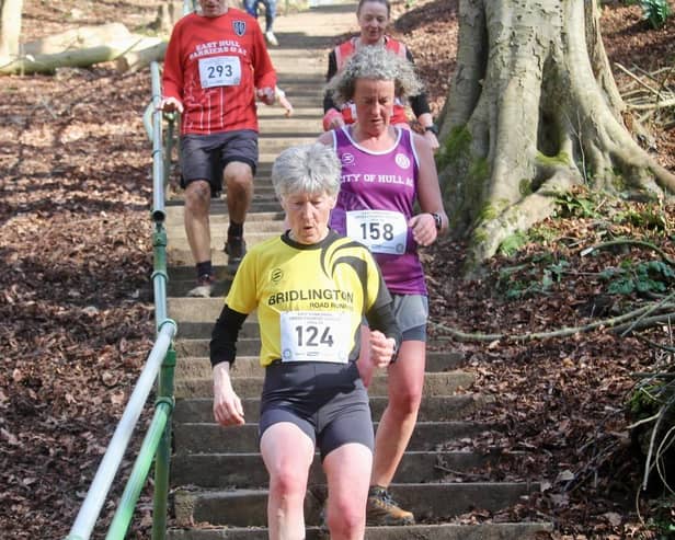 Trish Watson heads down the Danes Dyke steps in the East Yorkshire Cross Country League race.
