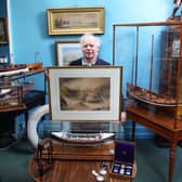 Charles Wallrock of Wick Antiques with the painting and other RNLI items from his new book