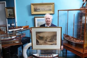 Charles Wallrock of Wick Antiques with the painting and other RNLI items from his new book