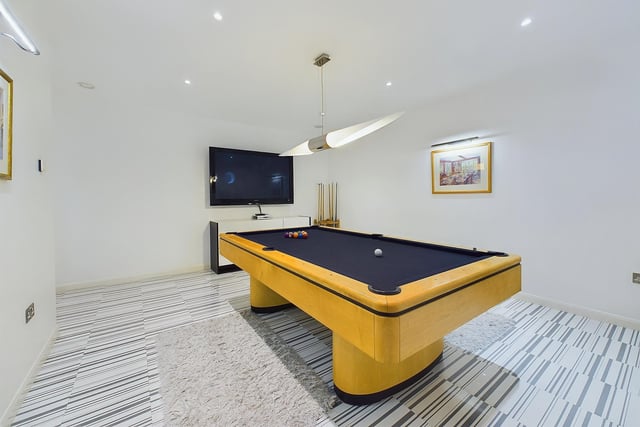 A billiards room adds to the entertainment facilities.