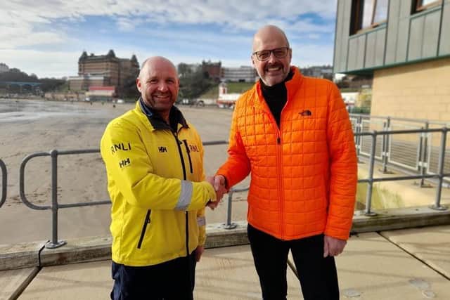 Scarborough Lifeboat Coxswain Lee Martin with Michael Whitely (right) (Pic: RNLI)