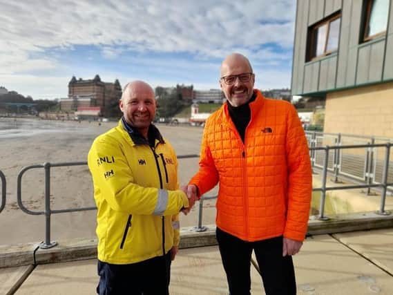 Scarborough Lifeboat Coxswain Lee Martin with Michael Whitely (right) (Pic: RNLI)
