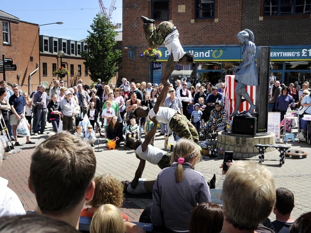 A group of street performers drew a big crowd in 2010.