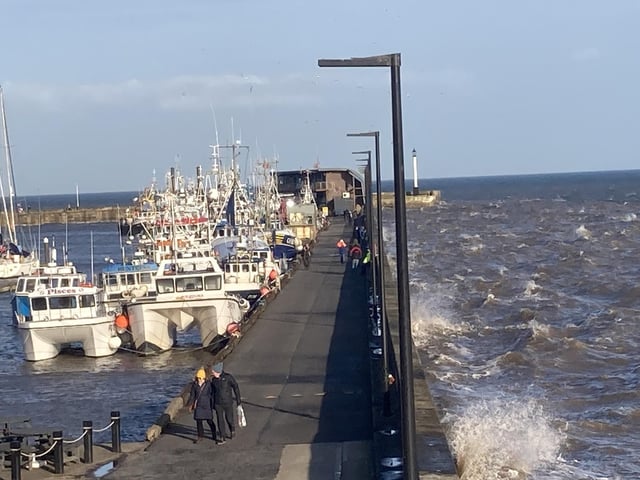 Couples were taking a romantic walk along the Bridlington Harbour viewpoint even though winds were blustery.
