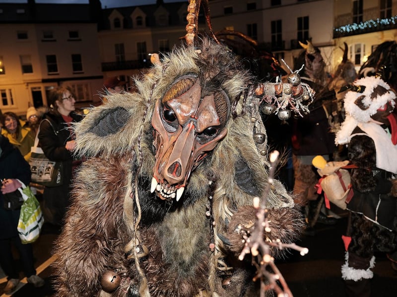 Krampus Run creatures descend in the parade.
picture: Richard Ponter