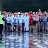 Some of the Boxing Day dippers in Whitby get ready to run into the sea.
picture: Brian Murfield
