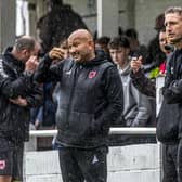 Former Blues boss Nathan Haslam, left, the current Guisborough Town manager, and Garty Liddle, the Whitby manager, take in the action during the rainy friendly. Photo by Brian Murfield