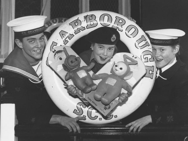 Sea Cadet Louise Smith is pictured with two of the precious Teletubby dolls the Scarborough unit were raffling for Christmas to raise funds in December, 1997. Louise is pictured with Able Cadet Mathew Davies, left, and Cadet Andrea Sheader. 
