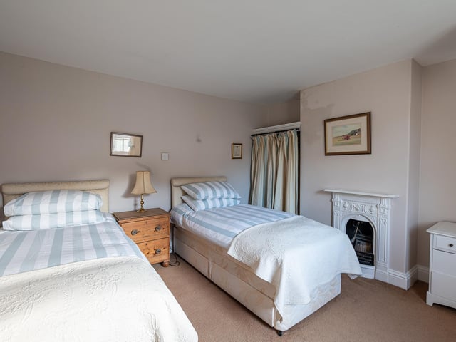 Another double bedroom, this time used as a twin, and again with a fireplace feature.