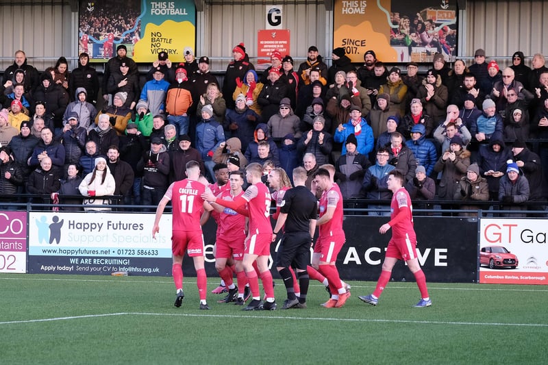 Scarborough Athletic players congratulate Bailey Gooda after he made the score 1-1 against Blyth.