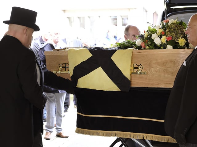 The flag draped coffin