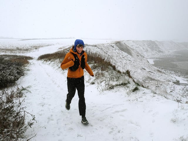 Running in the snow on the Cleveland Way. photo: Richard Ponter