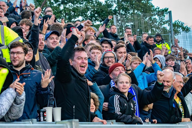 The Whitby Town fans cheer their leveller.