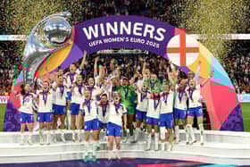 Leah Williamson and Keira Walsh of England lift the UEFA Women's EURO trophy after their team's victory in the UEFA Women's EURO 2025 Final match between England and Spain at St. Jakob-Park in Basel, Switzerland. (Photo by Alexander Hassenstein/Getty Images)