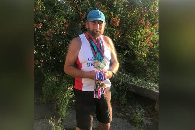 Paul Wheater with his strongman medals.