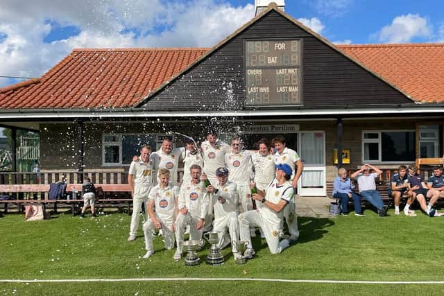 Ebberston CC celebrate their Premier Division title win.