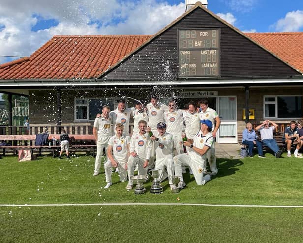 Ebberston CC celebrate their Premier Division title win.