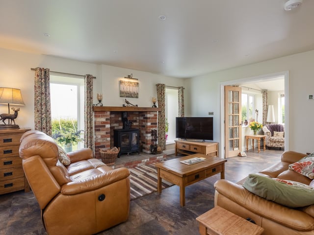 The open plan living room, with cosy stove.