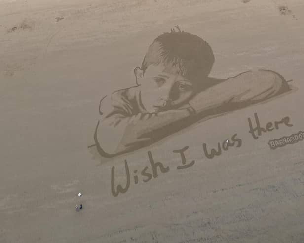 Barnardo's unveiled the giant sand portrait to highlight the impact of poverty on the nation’s children.