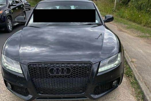 The driver of this car moved their registration plate.