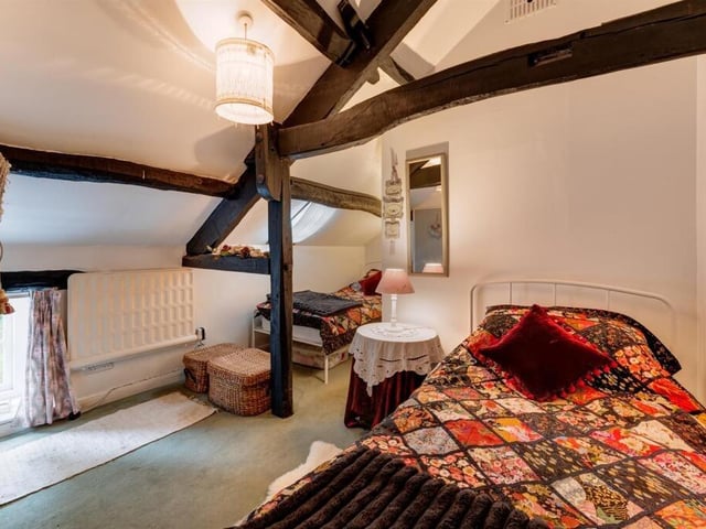 An upper floor bedroom with character and charm.