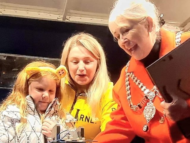Alya Stamp, 6, of East Whitby Academy, turns on Whitby's Christmas lights with Leah Hunter of Whitby RNLI and the Town Mayor, Cllr Linda Wild.
picture: Alan Wastell.
