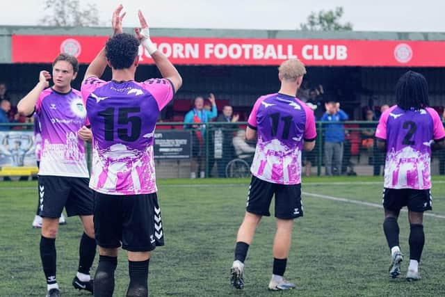 Whitby Town players applaud their travelling supporters after their excellent 6-3 win at Quorn. Photo by Owen Ciox