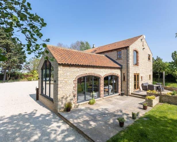 The house has gardens that wrap around it, and lovely views.