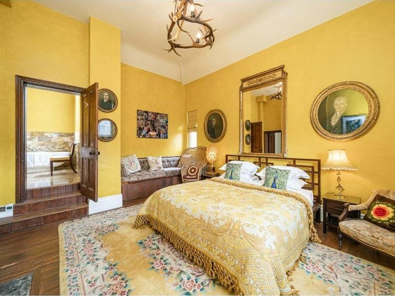 A golden theme for this beautiful bedroom.
