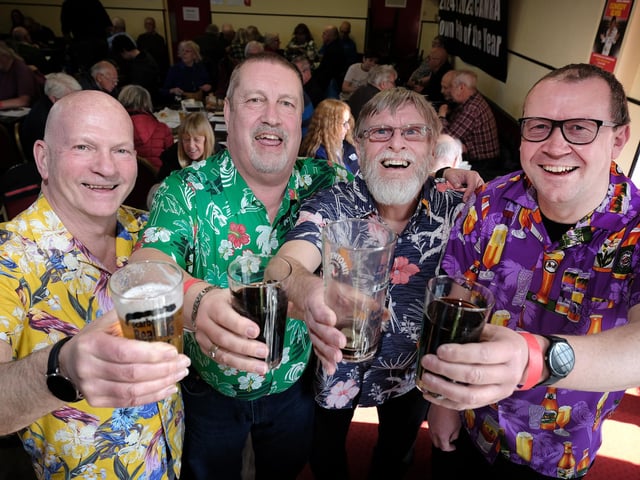 Cheers! Festival-goers raise a glass. picture: Richard Ponter