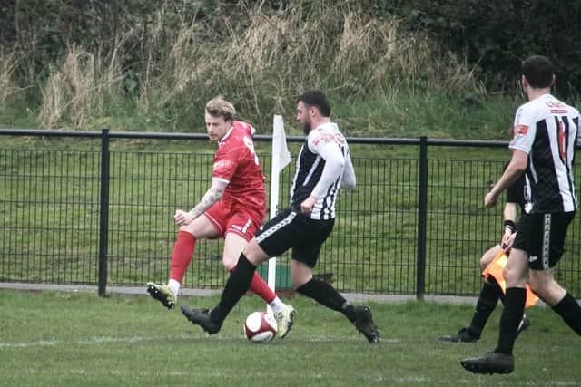 Josh Barrett in action for Bridlington Town at relegation rivals Heaton Stannington. Photo by Alexander Fynn