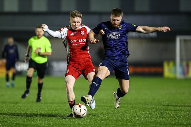 Boro winger Harry Green holds off Radcliffe's Brad Jackson. Photo by Zach Forster