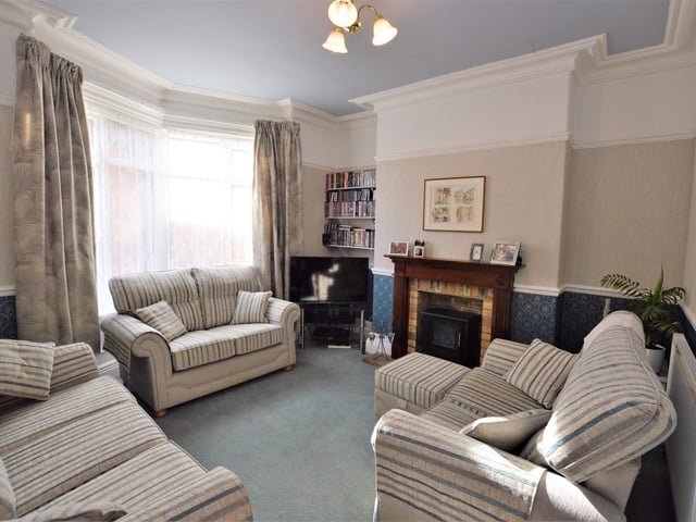 Another spacious reception room with period decorative features.