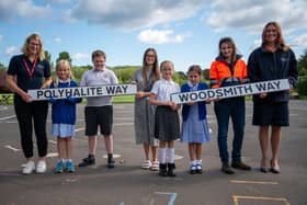 From left, Sarah Blackwell, Anglo American’s Customer Marketing Manager, Jess, Thomas, Miss Puckrin, Grace, Rumour, Phillipa Starmer, Area Manager, Shafts at Woodsmith, and Heather King, Community Relations Officer, with two of the road signs named by the Ruswarp School children.