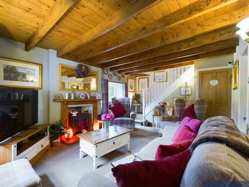 The beamed cottage interior has an appeal of its own.
