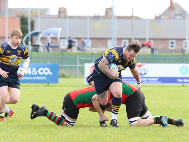 A Bridlington RUFC players looks to get through.