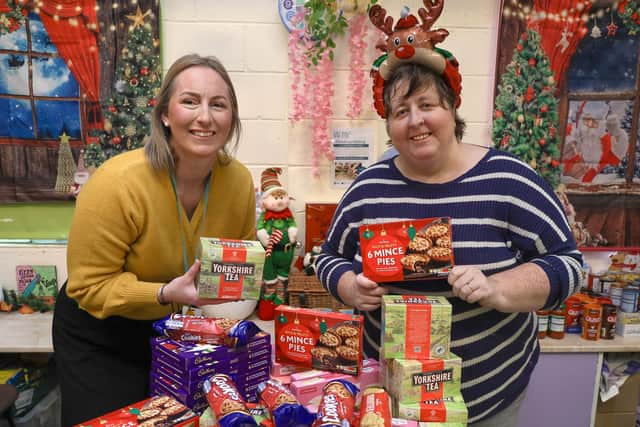 BH Community Partnership & Engagement Manager Stephanie Lake (left) handing over the donations
