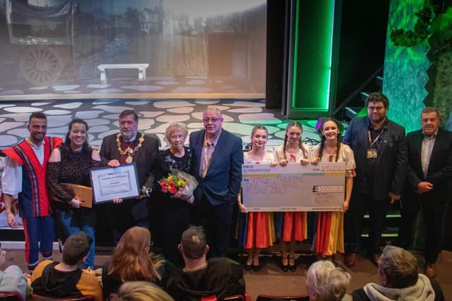 Four Rapunzel cast members joining, from left to right, Claire Edwards (Director of Rapunzel), Mayor of the Borough of Scarborough, Cllr Eric Broadbent, Susan Richards, Graham Ibbotson (Theatre Manager), Liam Downey (General Manager), Stephen Slade (Chair of the Board of YMCA Scarborough).