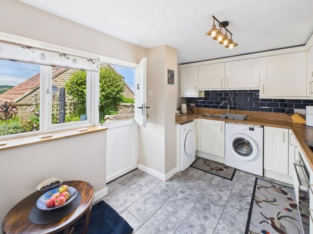 The kitchen has lovely far-reaching views from its windows.