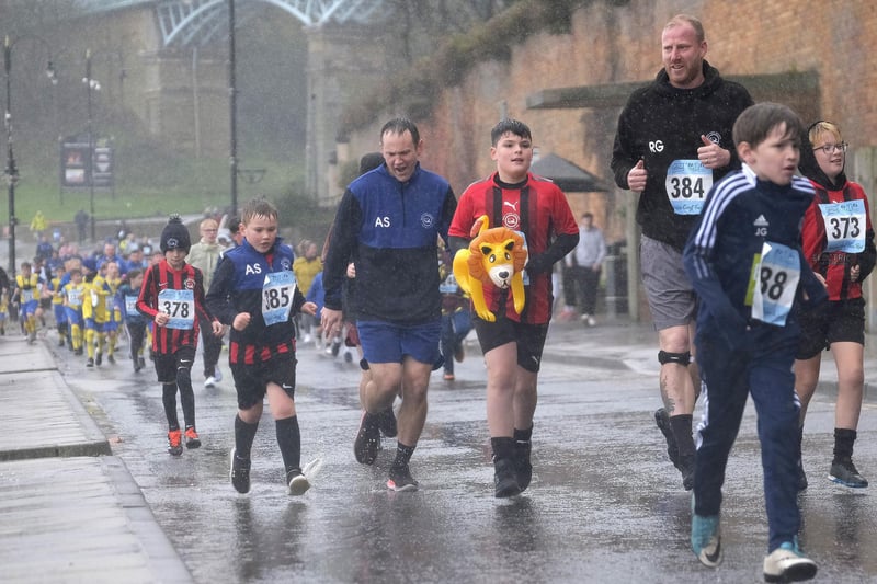 Youngsters braving the downpours.
