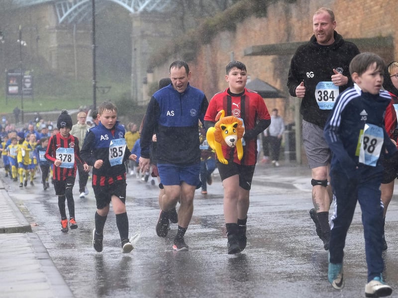 Youngsters braving the downpours.