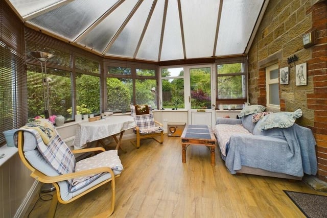 A roomy conservatory provides pleasant and flexible space.