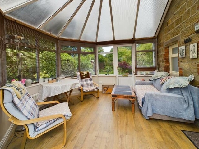 A roomy conservatory provides pleasant and flexible space.