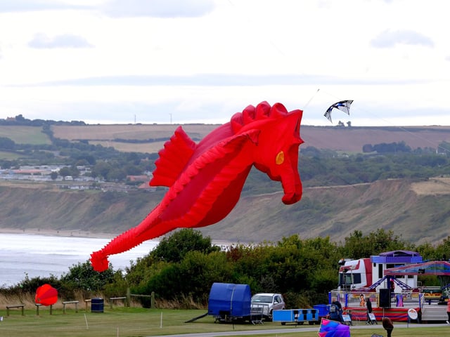 The giant red seahorse towers overhead.