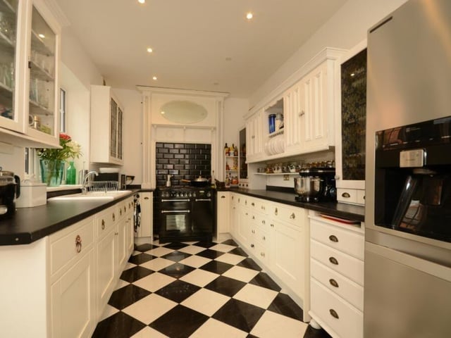 The fitted kitchen includes some integrated appliances.