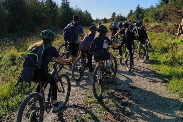 Hawsker School youngsters cycling through the forestry.