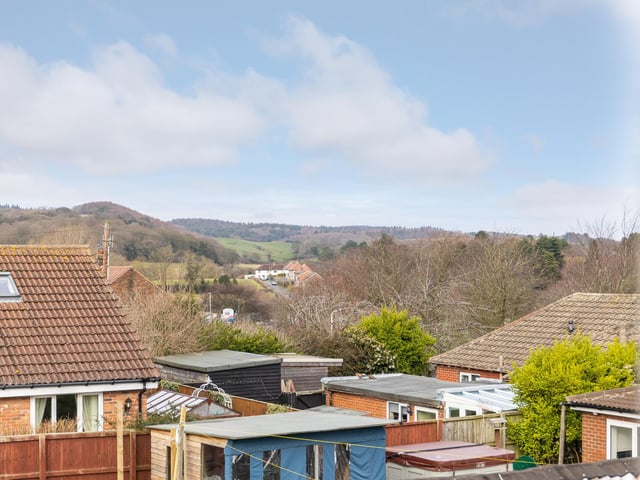 The house has views of fields and trees, and is situated in great walking country, while still being just a stroll from the coast.