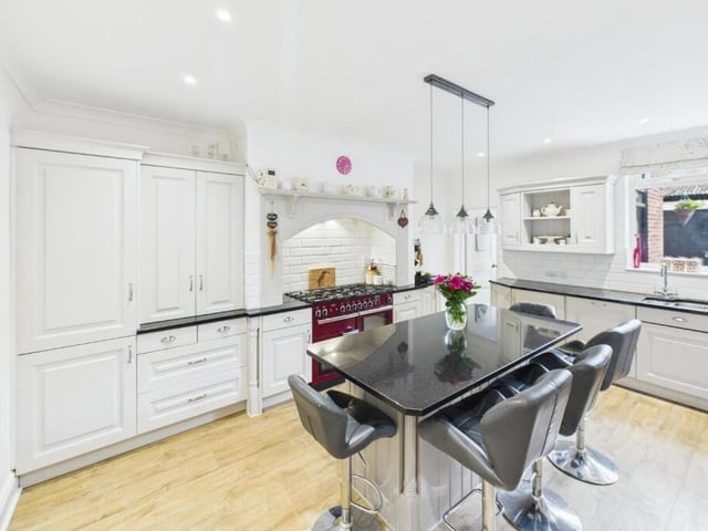 The breakfast kitchen with fitted units and granite worktops has underfloor heating.